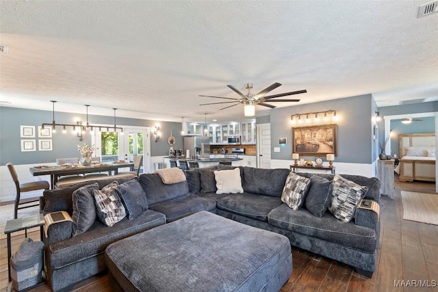 103 Thomas Ct, Prattville, AL 36067 - living room featuring a ceiling fan, dark wood-style floors, and a textured ceiling