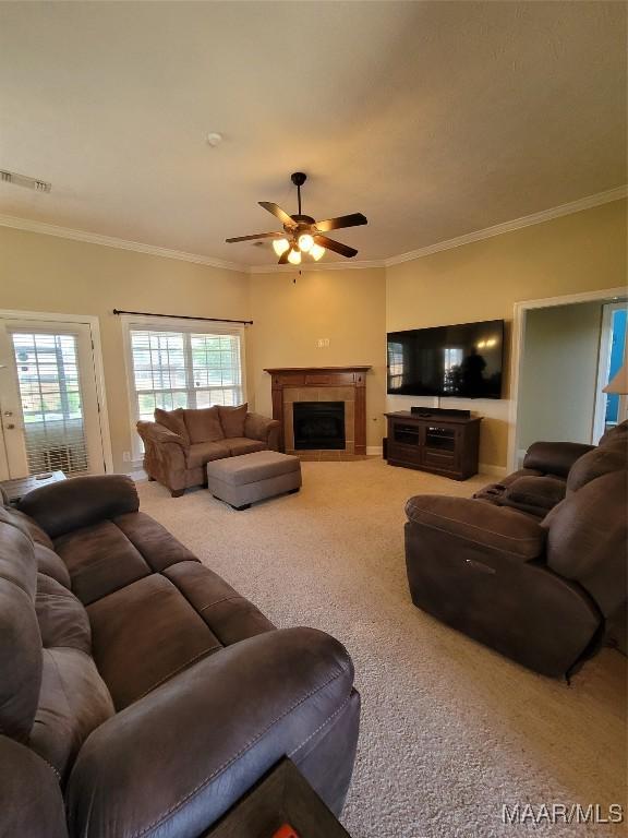 109 Coleman Dr, Prattville, AL 36067 - living area featuring carpet flooring, a ceiling fan, ornamental molding, and a tile fireplace