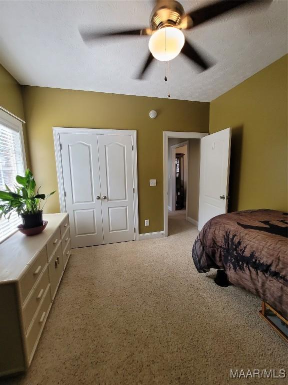 109 Coleman Dr, Prattville, AL 36067 - bedroom featuring light carpet, a ceiling fan, and baseboards