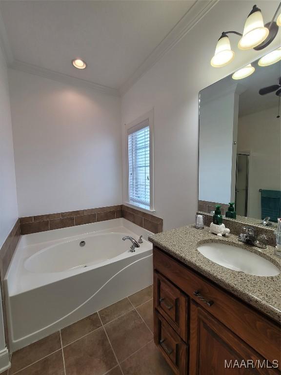 109 Coleman Dr, Prattville, AL 36067 - bathroom with tile patterned flooring, a bath, vanity, ornamental molding, and a stall shower