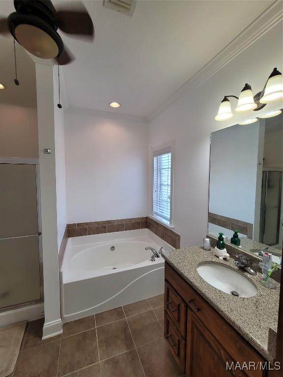 109 Coleman Dr, Prattville, AL 36067 - bathroom featuring tile patterned flooring, a bath, a shower stall, vanity, and crown molding