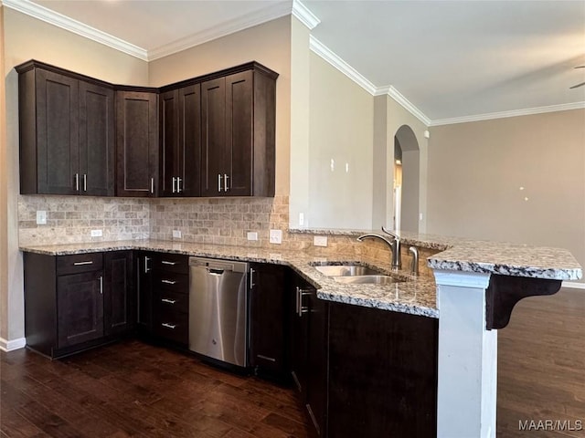 9145 Autumn Brooke Way, Montgomery, AL 36117 - kitchen with dishwasher, a peninsula, dark wood-style flooring, light stone counters, and a kitchen bar