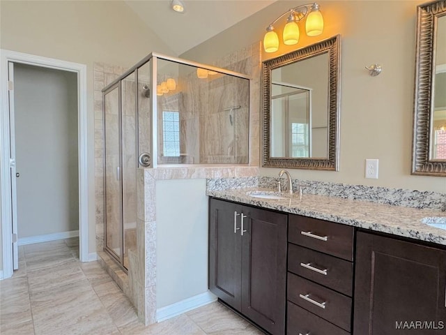 9145 Autumn Brooke Way, Montgomery, AL 36117 - full bathroom featuring a shower stall, double vanity, and lofted ceiling