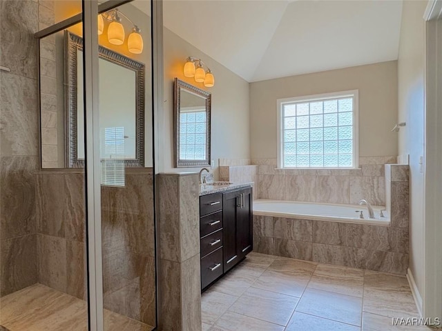 9145 Autumn Brooke Way, Montgomery, AL 36117 - bathroom featuring vanity, a bath, tiled shower, tile patterned floors, and vaulted ceiling