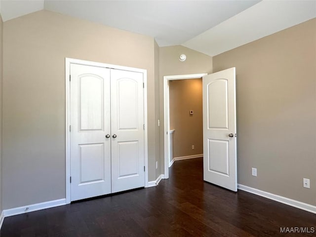 9145 Autumn Brooke Way, Montgomery, AL 36117 - unfurnished bedroom featuring vaulted ceiling, dark wood finished floors, and a closet