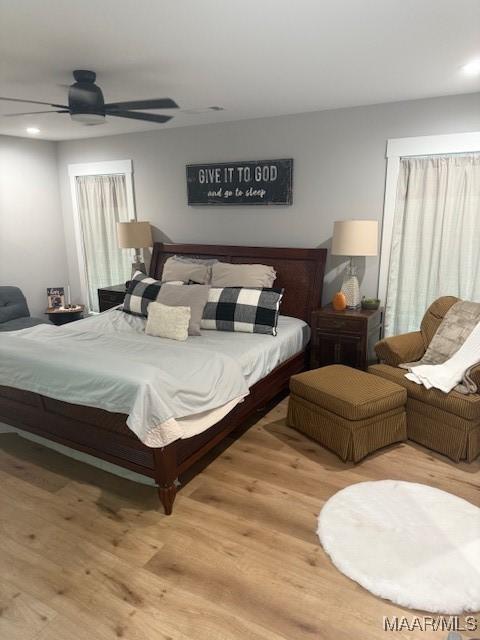 bedroom with light wood finished floors, recessed lighting, and a ceiling fan