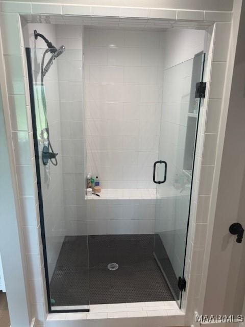 bathroom featuring a shower stall