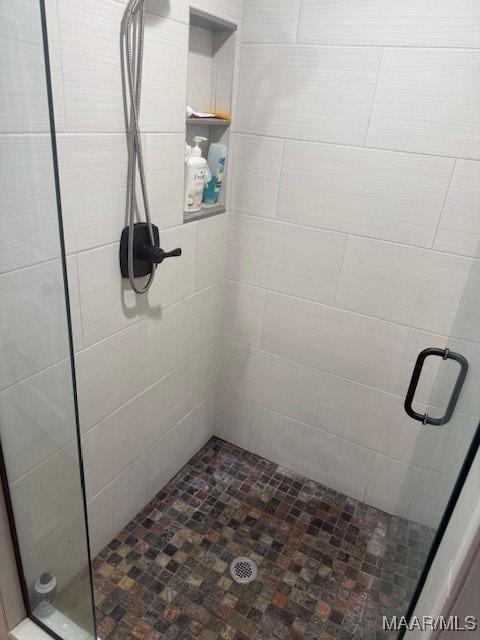 full bathroom with a shower stall