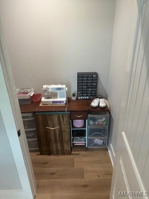 home office with light wood-style flooring
