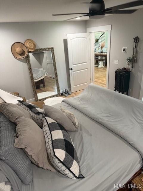 bedroom with wood finished floors and ceiling fan