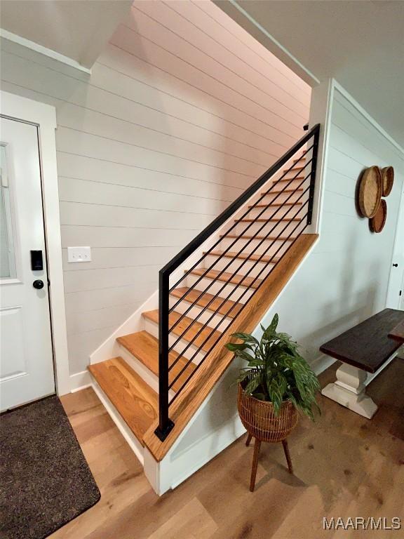 2533 Weldon Rd, Tallassee, AL 36078 - staircase with wood finished floors and wood walls