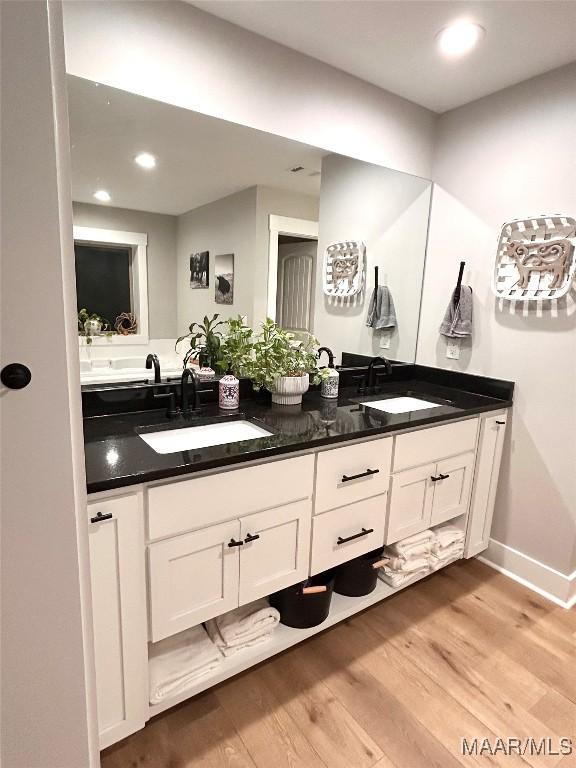 2533 Weldon Rd, Tallassee, AL 36078 - bathroom with double vanity, wood finished floors, and recessed lighting