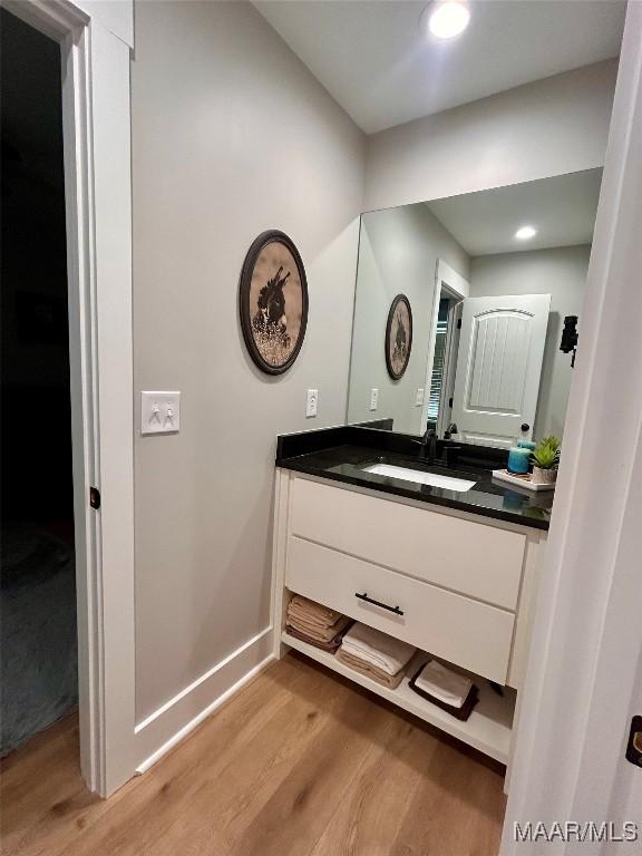 2533 Weldon Rd, Tallassee, AL 36078 - bathroom featuring wood finished floors, vanity, and recessed lighting