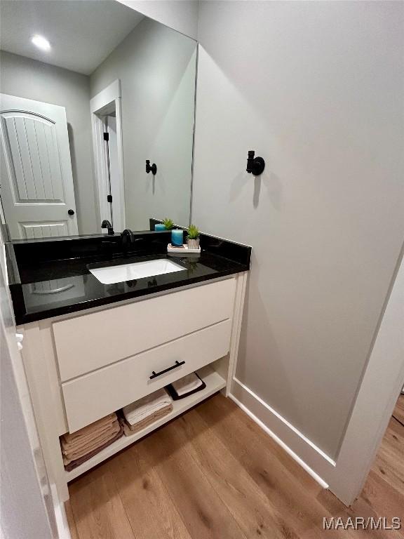 2533 Weldon Rd, Tallassee, AL 36078 - bathroom featuring wood finished floors and vanity