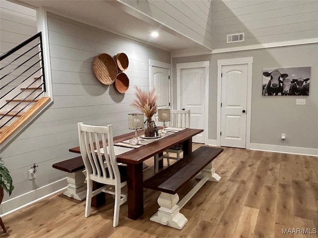 2533 Weldon Rd, Tallassee, AL 36078 - dining space with wood walls and light wood-type flooring