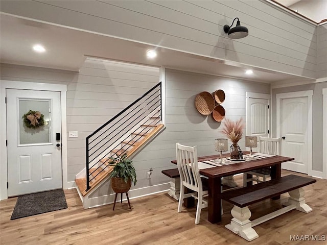 2533 Weldon Rd, Tallassee, AL 36078 - dining area with stairs, light wood-style floors, wood walls, and recessed lighting