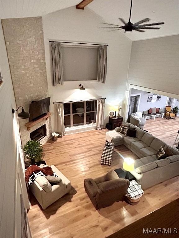 2533 Weldon Rd, Tallassee, AL 36078 - living room with wood finished floors, a ceiling fan, and a fireplace