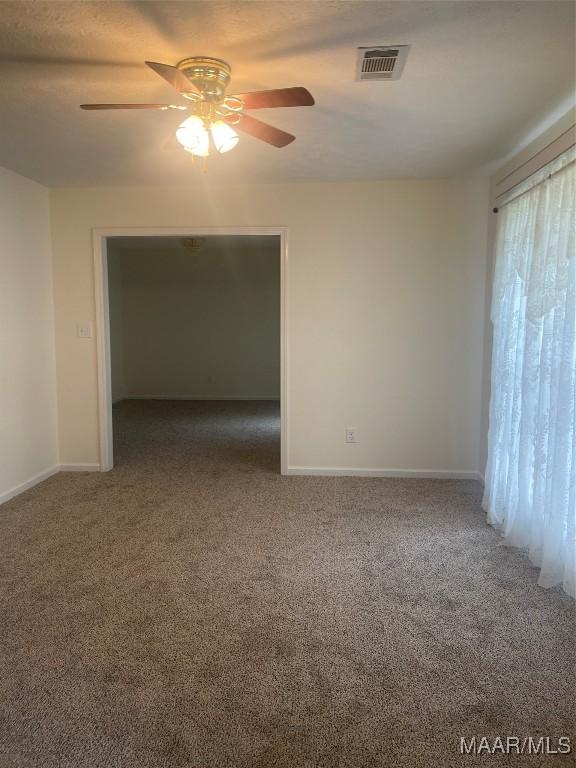 176 Lawrence Cv, Valley Grande, AL 36703 - carpeted spare room with a ceiling fan and baseboards
