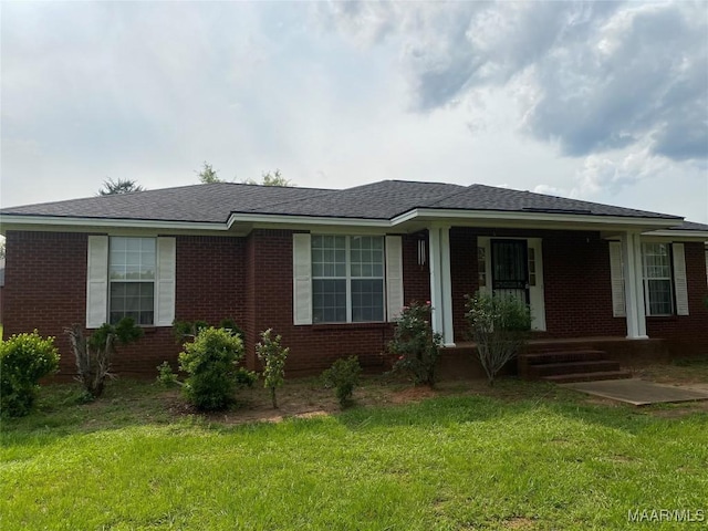 176 Lawrence Cv, Valley Grande, AL 36703 - ranch-style home featuring a front yard, brick siding, and covered porch