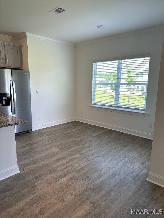 5168 Sedona Dr, Montgomery, AL 36116 - unfurnished living room with dark wood-style flooring, ornamental molding, and baseboards