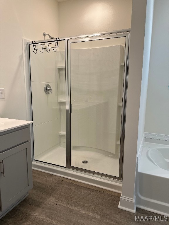 5168 Sedona Dr, Montgomery, AL 36116 - bathroom with a stall shower, a garden tub, vanity, and wood finished floors