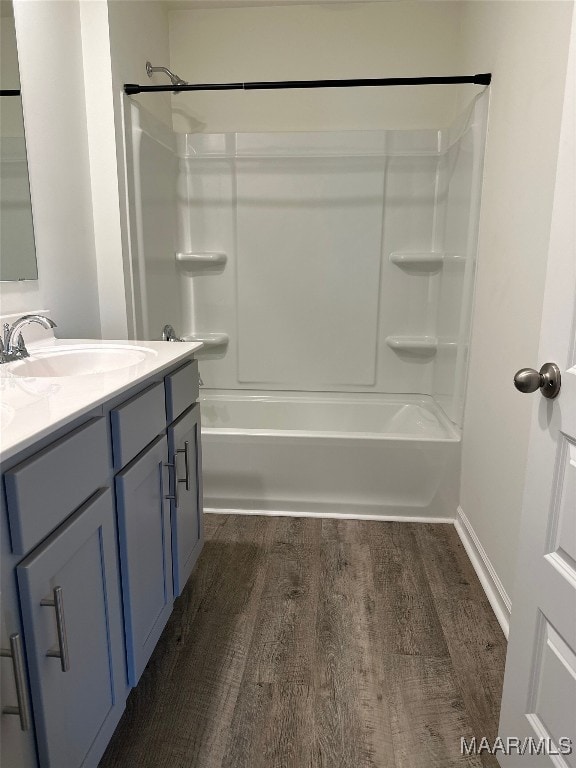 5168 Sedona Dr, Montgomery, AL 36116 - full bath featuring wood finished floors, vanity, washtub / shower combination, and baseboards
