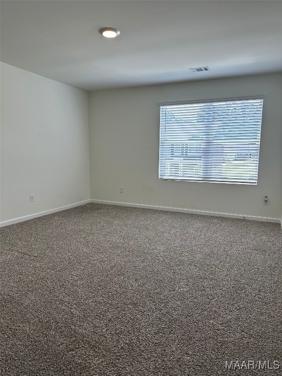 5168 Sedona Dr, Montgomery, AL 36116 - spare room featuring baseboards and carpet flooring