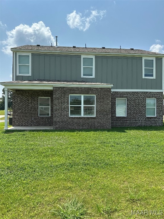 5168 Sedona Dr, Montgomery, AL 36116 - rear view of property featuring board and batten siding, a lawn, and brick siding