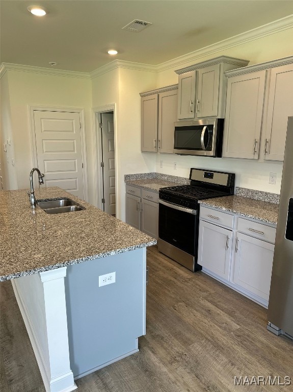 5168 Sedona Dr, Montgomery, AL 36116 - kitchen with appliances with stainless steel finishes, a sink, dark wood-style flooring, stone counters, and ornamental molding