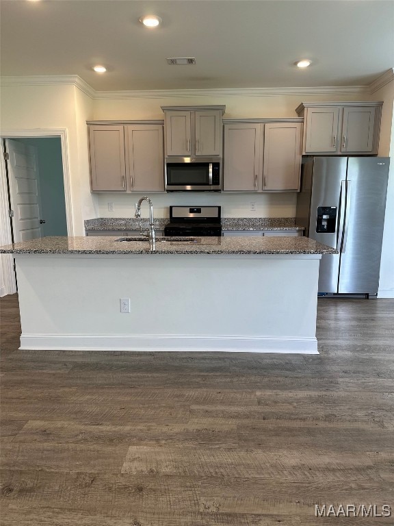 5168 Sedona Dr, Montgomery, AL 36116 - kitchen with appliances with stainless steel finishes, gray cabinets, stone countertops, ornamental molding, and a kitchen island with sink