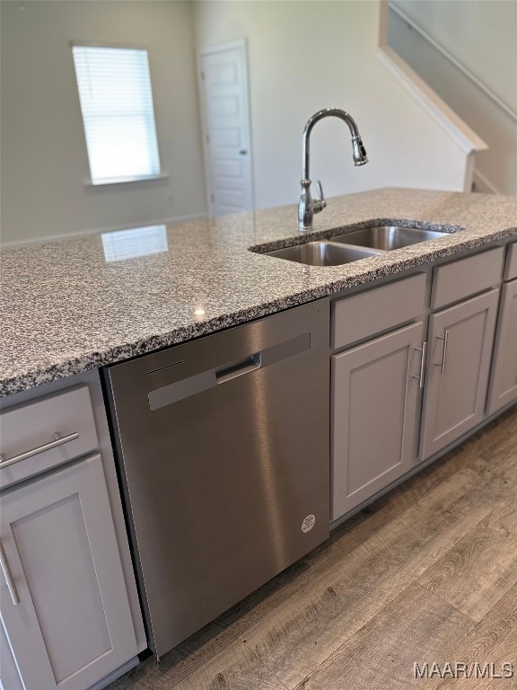 5168 Sedona Dr, Montgomery, AL 36116 - kitchen with dishwasher, a sink, light stone countertops, light wood finished floors, and gray cabinets