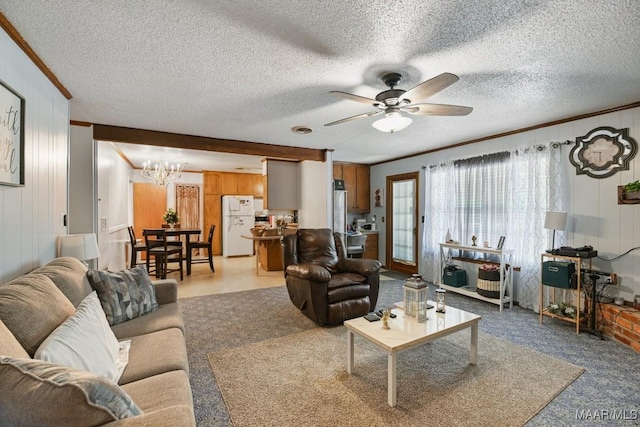 6221 Hinchcliff Dr, Montgomery, AL 36117 - living room with ceiling fan, a chandelier, wooden walls, carpet flooring, and ornamental molding