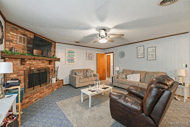 6221 Hinchcliff Dr, Montgomery, AL 36117 - carpeted living room with a ceiling fan, a fireplace, ornamental molding, and a textured ceiling
