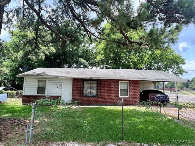 124 W Michigan Ave, Montgomery, AL 36110 - ranch-style house featuring brick siding, a carport, and driveway