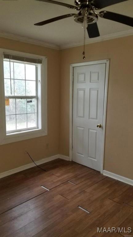 124 W Michigan Ave, Montgomery, AL 36110 - unfurnished room featuring a ceiling fan, ornamental molding, baseboards, and wood finished floors