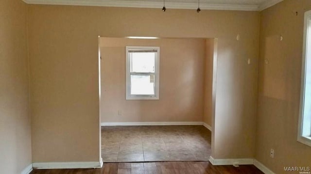 124 W Michigan Ave, Montgomery, AL 36110 - unfurnished room featuring ornamental molding, baseboards, and wood finished floors