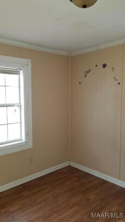 124 W Michigan Ave, Montgomery, AL 36110 - empty room featuring wood finished floors, ornamental molding, and baseboards