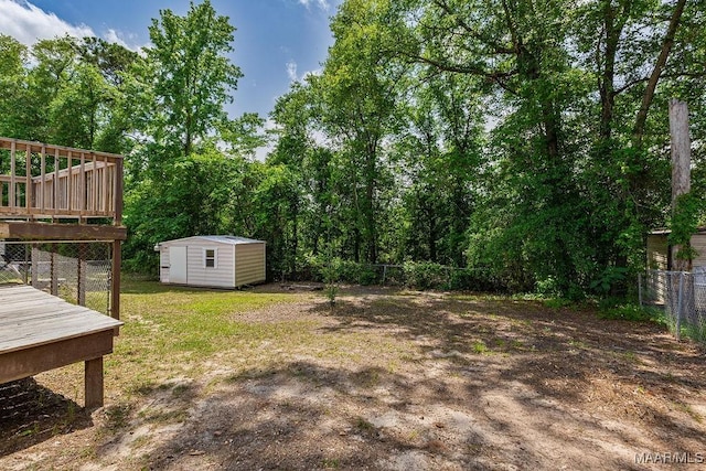 461 W Dr, Prattville, AL 36067 - fenced backyard with a storage unit, a deck, and an outdoor structure