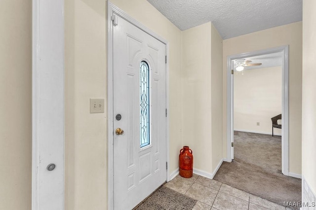 461 W Dr, Prattville, AL 36067 - entrance foyer with light carpet, light tile patterned floors, baseboards, healthy amount of natural light, and a textured ceiling