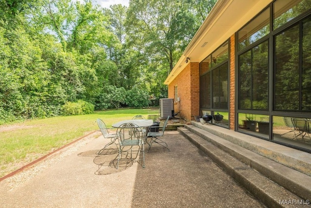view of patio / terrace featuring outdoor dining space and central AC
