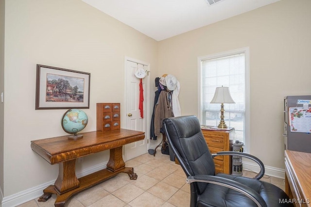 office with light tile patterned floors and baseboards