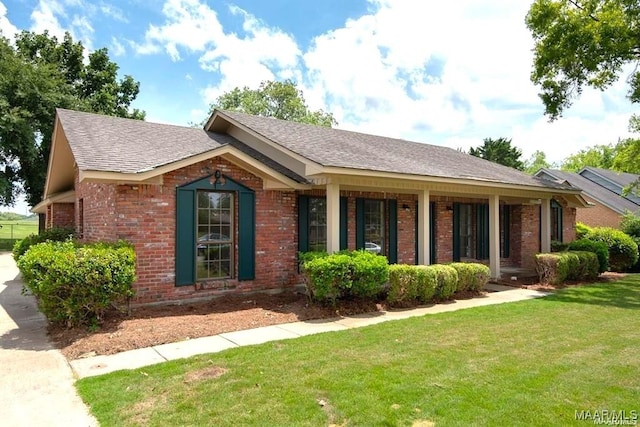 3136 Fitzgerald Rd, Montgomery, AL 36106 - ranch-style house with a front lawn, brick siding, and a shingled roof