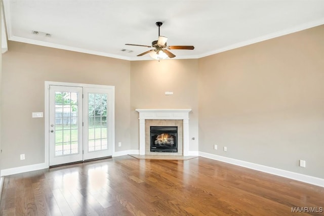 612 Coleman Way, Prattville, AL 36067 - unfurnished living room featuring a ceiling fan, wood finished floors, a tile fireplace, crown molding, and baseboards