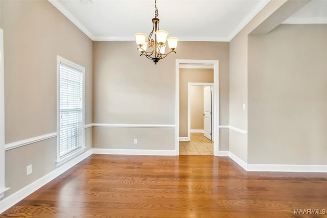 612 Coleman Way, Prattville, AL 36067 - empty room featuring a chandelier, ornamental molding, wood finished floors, and baseboards