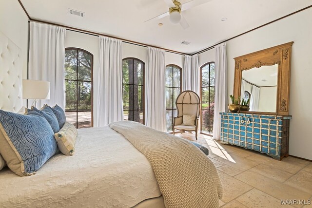 1777 Barganier Rd, Cecil, AL 36013 - bedroom featuring multiple windows, stone tile floors, and a ceiling fan
