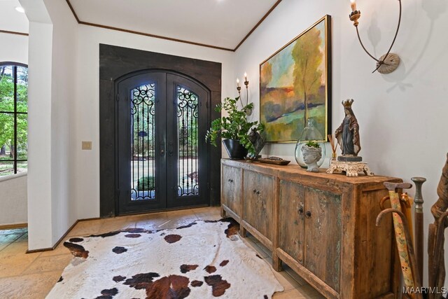 1777 Barganier Rd, Cecil, AL 36013 - entryway featuring french doors, crown molding, arched walkways, and stone tile floors