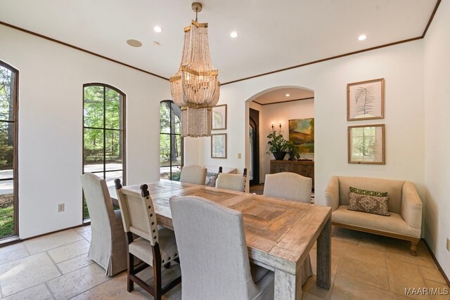 1777 Barganier Rd, Cecil, AL 36013 - dining room with stone tile flooring, recessed lighting, ornamental molding, arched walkways, and a chandelier