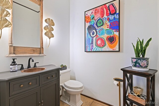 1777 Barganier Rd, Cecil, AL 36013 - bathroom with toilet, vanity, and tile patterned flooring