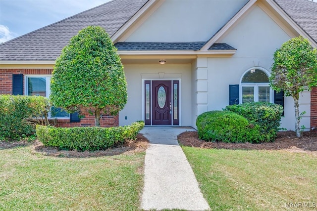 2224 Halcyon Blvd, Montgomery, AL 36117 - entrance to property featuring roof with shingles, a lawn, and stucco siding