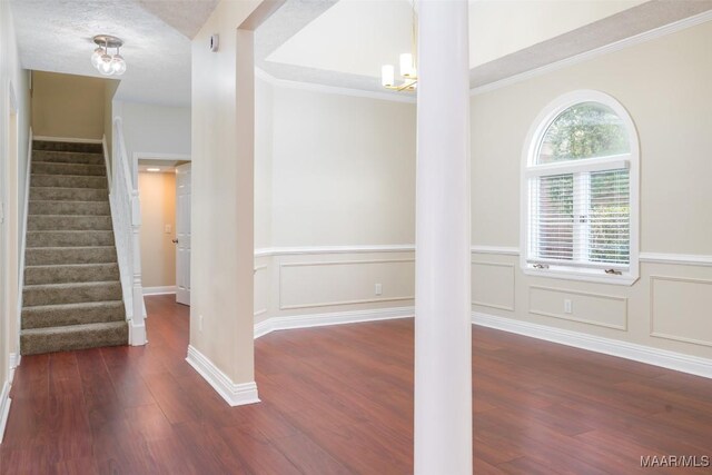 2224 Halcyon Blvd, Montgomery, AL 36117 - entryway with wood finished floors, stairs, wainscoting, decorative columns, and a chandelier
